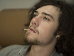 young man smoking marijuana